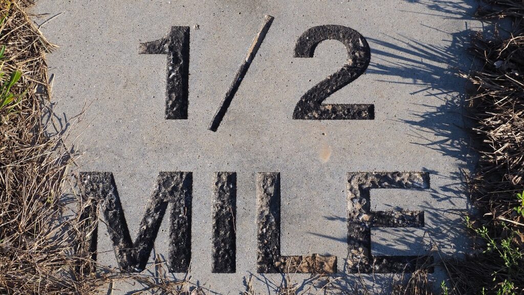 half mile marker, marathon marker, half mile, running, sign, park sign, gray running, gray run